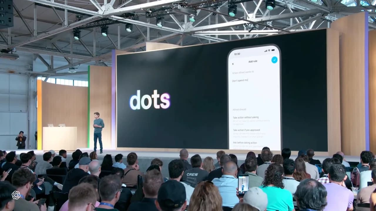 OpenAI’s DevDay keynote shows Dots and action rules on the presentation screen.