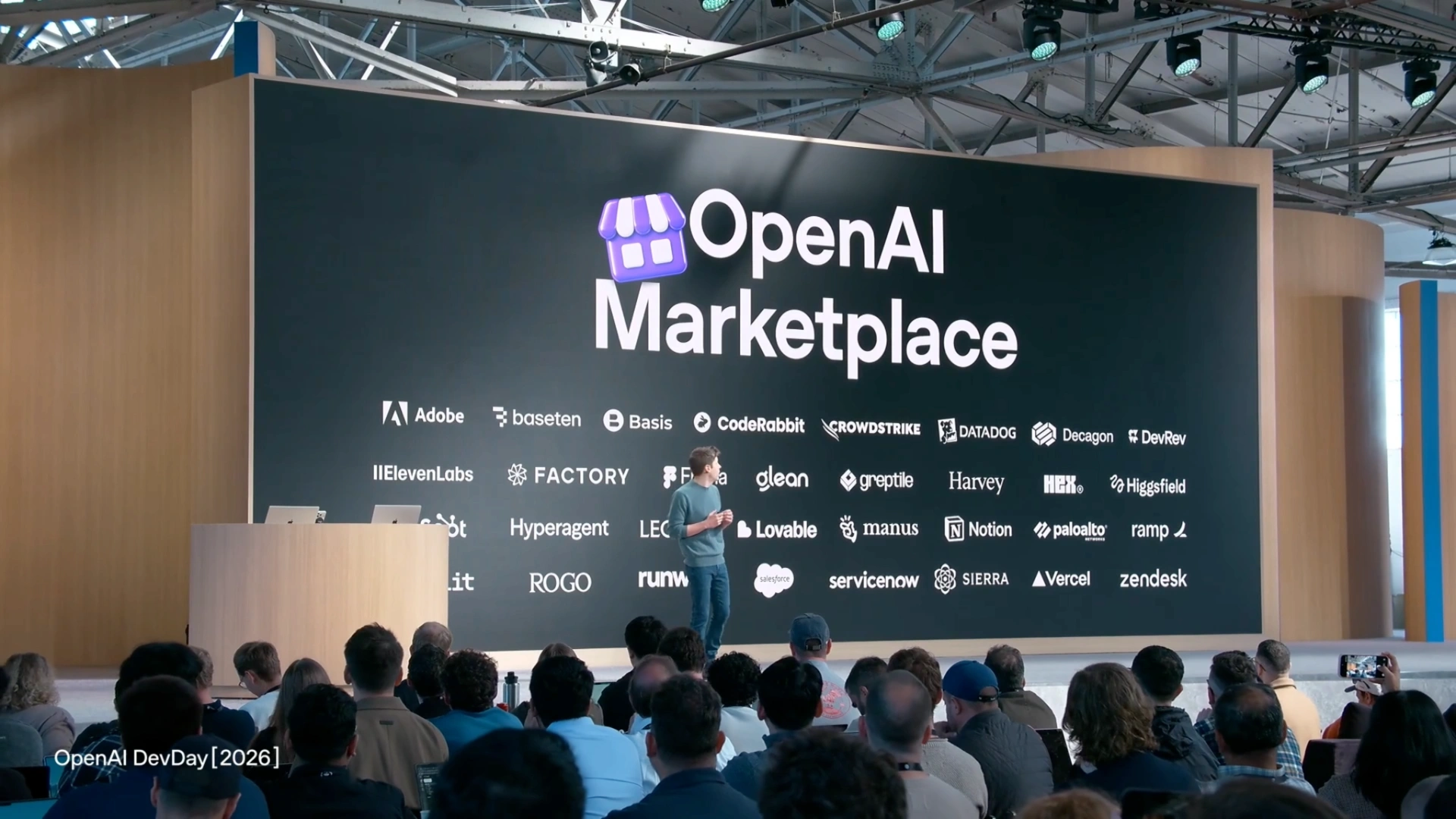 The presentation screen reads “OpenAI Marketplace” above a grid of partner logos.
